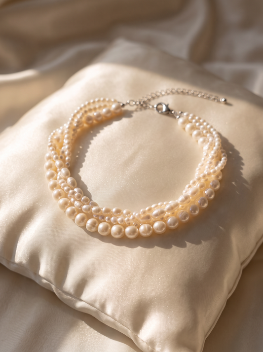 La Marea triple-strand baroque pearl necklace with silver clasp
