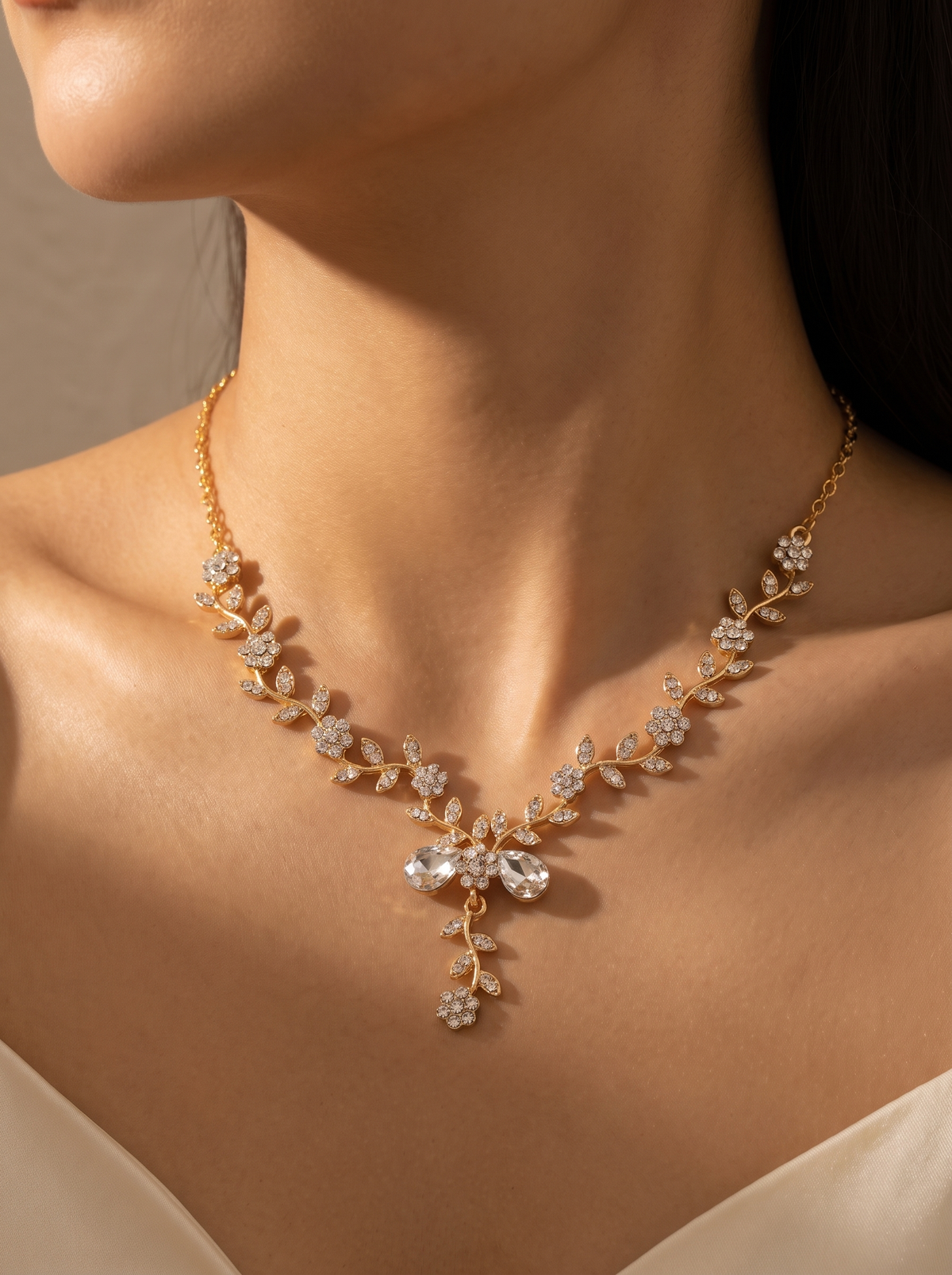 Il Ramo necklace close-up on the collarbone — FYNX