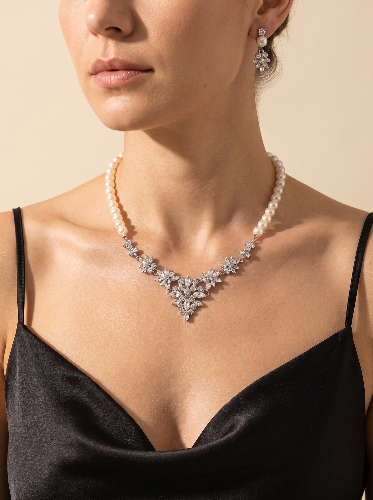 La Bruma pearl necklace and earring set worn by a model — FYNX