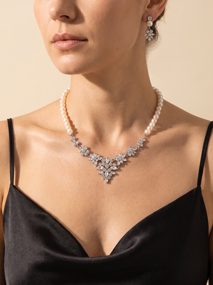 La Bruma pearl necklace and earring set worn by a model — FYNX