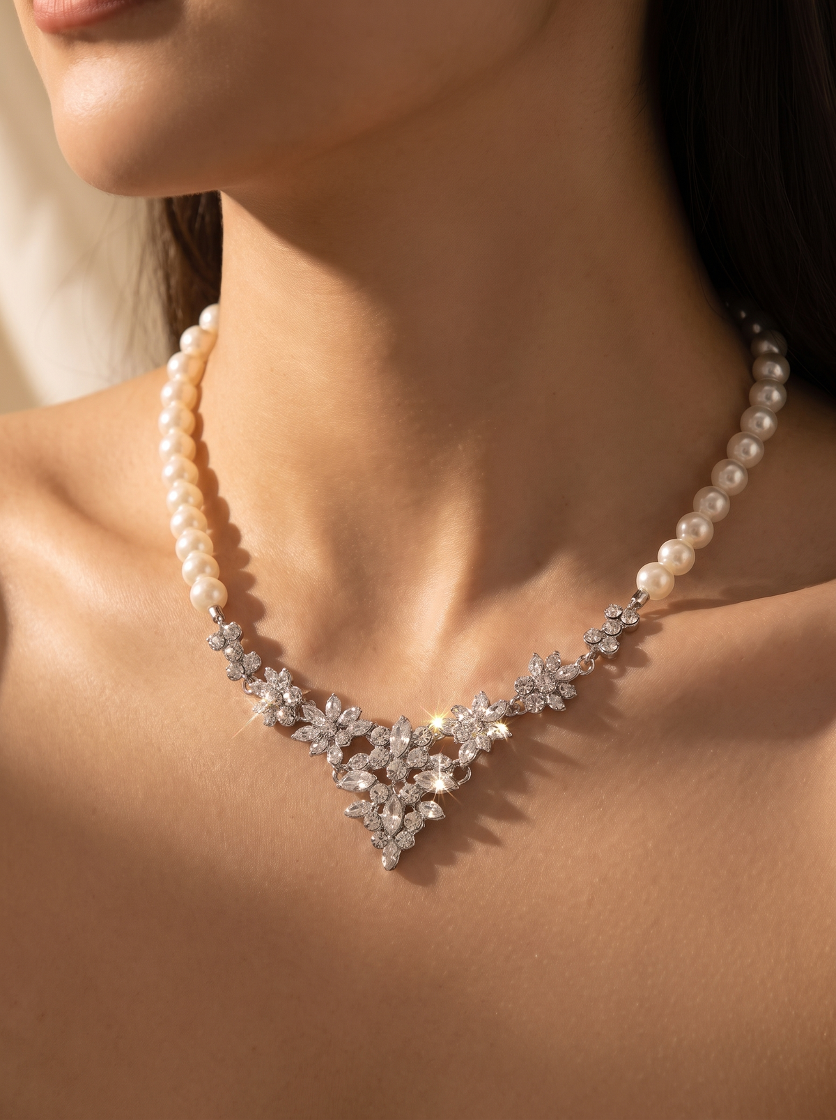 La Bruma pearl necklace close-up on the collarbone — FYNX