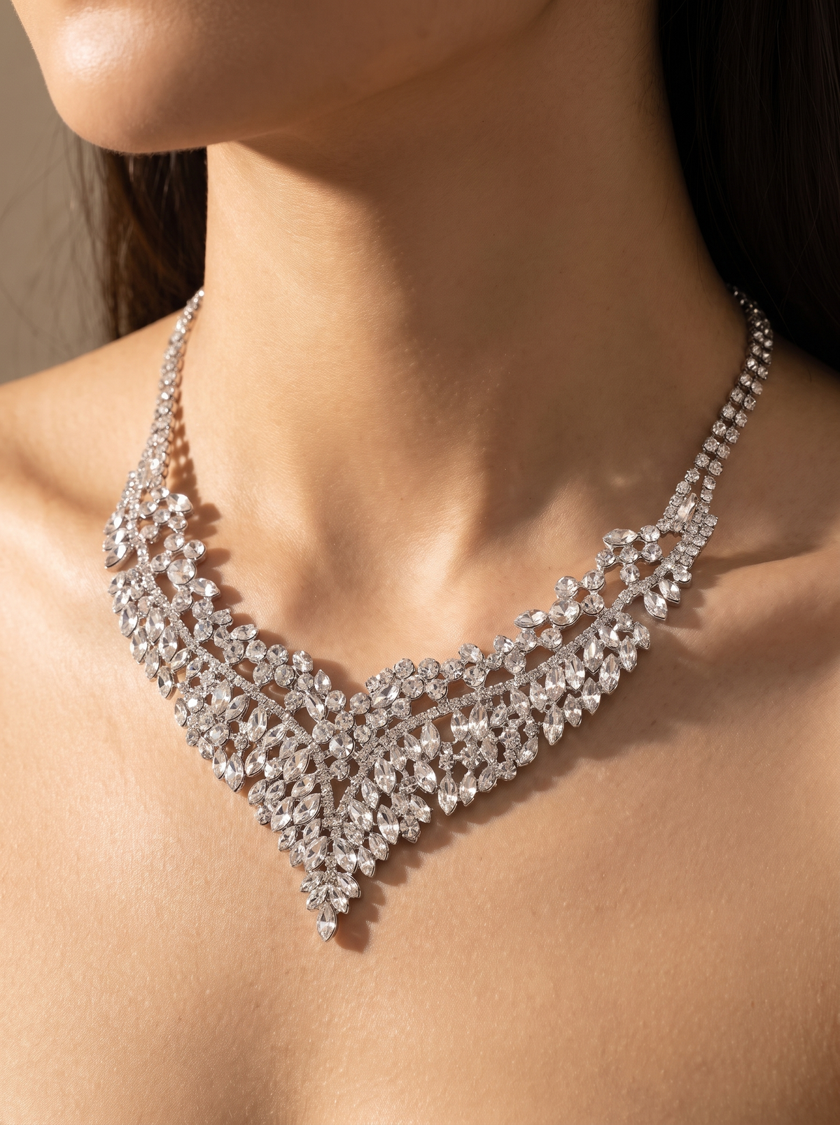 La Regina crystal collar close-up on the collarbone — FYNX