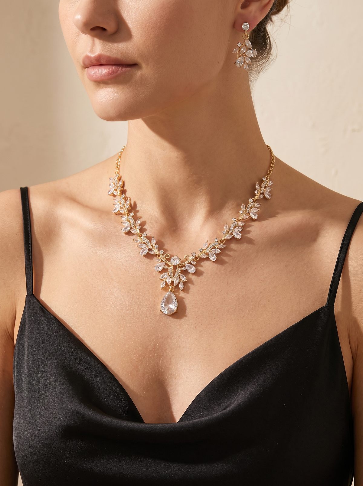 Le Foglie necklace and earring set worn by a model — FYNX